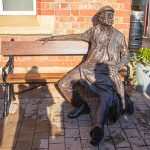 The bronzed and completed Man on the Bench, Irlam Station, October 2019
